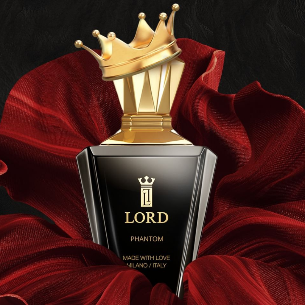 A luxurious black and gold unisex PHANTOM Eau De Parfum by LORD MILANO, featuring a crown-shaped cap, is displayed before flowing red fabric on a dark background. The bottle reads "Made with love, Milano / Italy.