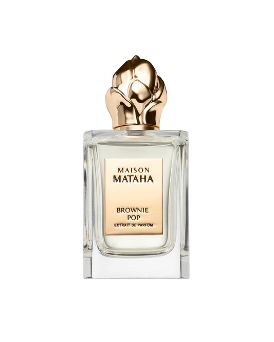 A clear glass Brownie Pop Extrait de Parfum by Fragrapedia Haus with a gold floral cap is showcased against a white background—a gourmet scent evoking brownie fragrance.