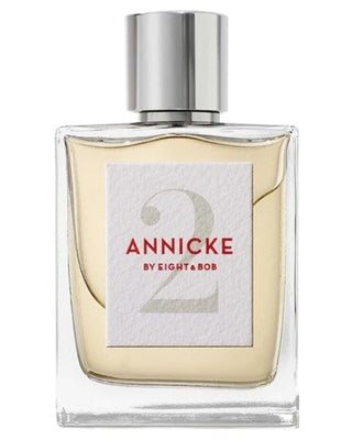 A rectangular glass perfume bottle with a silver cap and light yellow liquid. The label reads Annicke 2 Eau de Parfum - Eight and Bob by Fragrapedia Haus—a refined Oriental Floral fragrance.