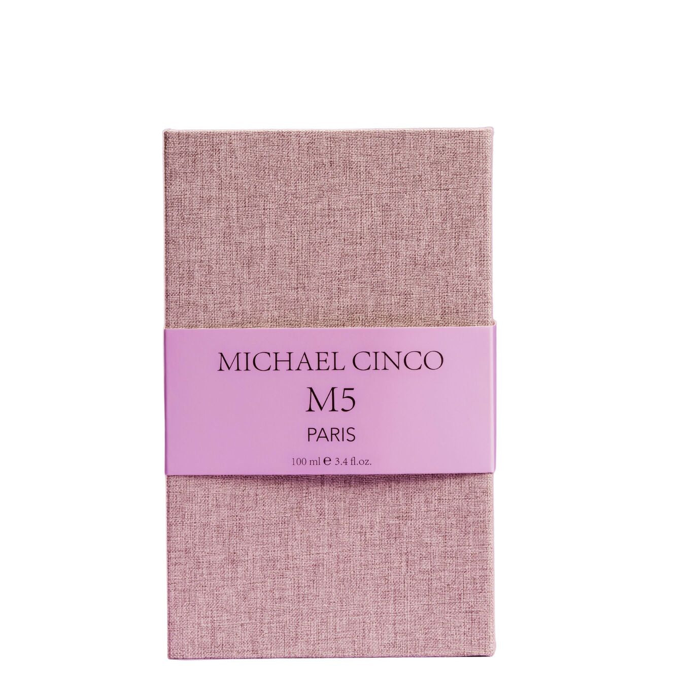A rectangular box in textured light pink fabric with a matching band, labeled Fragrapedia Haus M5 Eau de Parfum by Michael Cinco, 100 ml e 3.4 fl.oz, hints at the luxurious and seductive scent inside.