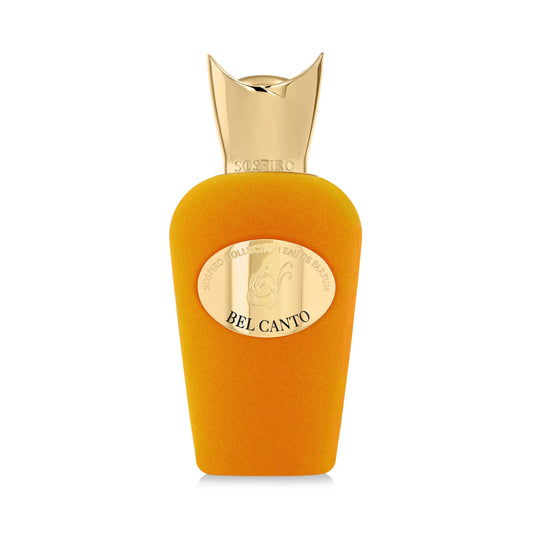 A gold-capped perfume bottle with a velvety orange body and oval gold label reading "SOSPIRO COLLECTION EAU DE PARFUM BEL CANTO." Bel Canto Eau de Parfum by SOSPIRO is a jasmine perfume with a delicate floral scent, shown on a white background.