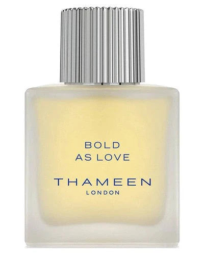 A bottle of Bold As Love Eau de Cologne by Fragrapedia Haus features a frosted rectangular glass design, tall silver ridged cap, and bold blue text—embodying the smoky leather essence in every detail.