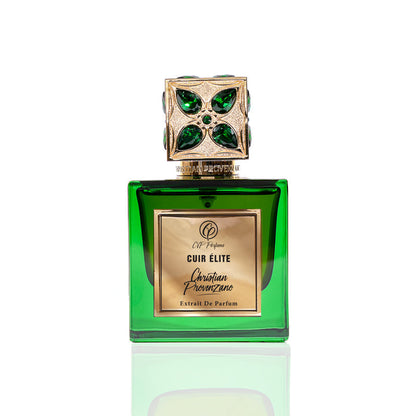 A green glass bottle with a gold label reading Cuir Elite Eau de Parfum by Christian Provenzano features an ornate gold cap accented with green gems, emphasizing the fragrance’s luxury against a crisp white background.