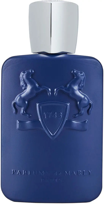 The Percival Eau de Parfum by Parfums de Marly comes in a blue bottle with embossed rearing horses and a 1743 shield, finished with a shiny silver cap. This elegant fragrance features woody spice notes.