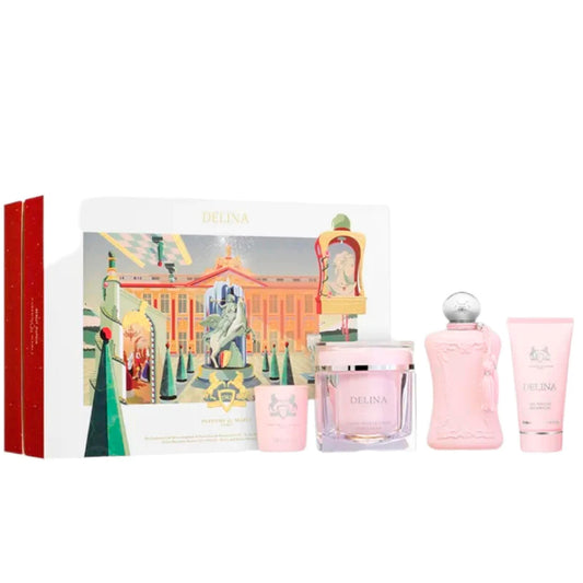 The Parfums de Marly Delina Gift Set by Parfums de Marly includes a floral fragrance, pink candle, jar, tasseled perfume bottle, and body lotion tube in a decorative box.