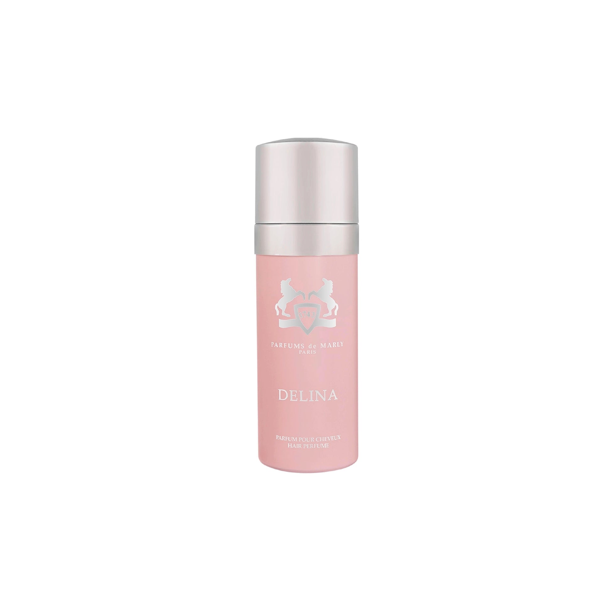 A pink bottle of Parfums de Marly Delina Hair Mist with a silver cap is displayed on a white background, designed to leave hair delicately scented.