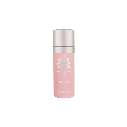 A pink bottle of Parfums de Marly Delina Hair Mist with a silver cap is displayed on a white background, designed to leave hair delicately scented.