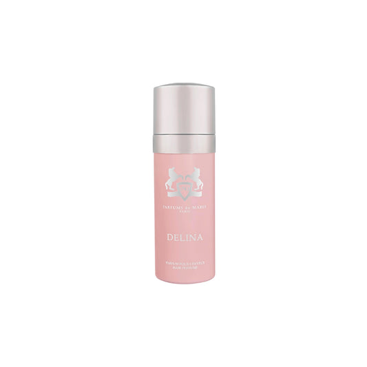 A pink bottle of Parfums de Marly Delina Hair Mist with a silver cap is displayed on a white background, designed to leave hair delicately scented.