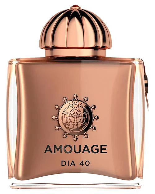 A square, rose gold bottle labeled Dia 40 Woman Eau de Parfum by Fragrapedia Haus features an ornate round emblem and domed cap, echoing the timeless elegance of vintage aldehydic florals in this exquisite Amouage extrait.