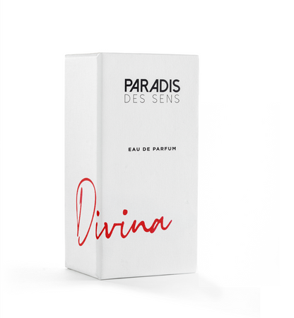 A white perfume box labeled PARADIS DES SENS and Divina Eau de Parfum features minimal, elegant packaging that hints at the gourmand scent of this luxurious Paradis Des Sens fragrance.