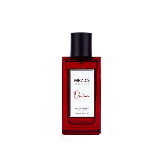 A rectangular red glass Divina Eau de Parfum by PARADIS DES SENS, with a black cap and gourmand scent, is displayed on a white background.