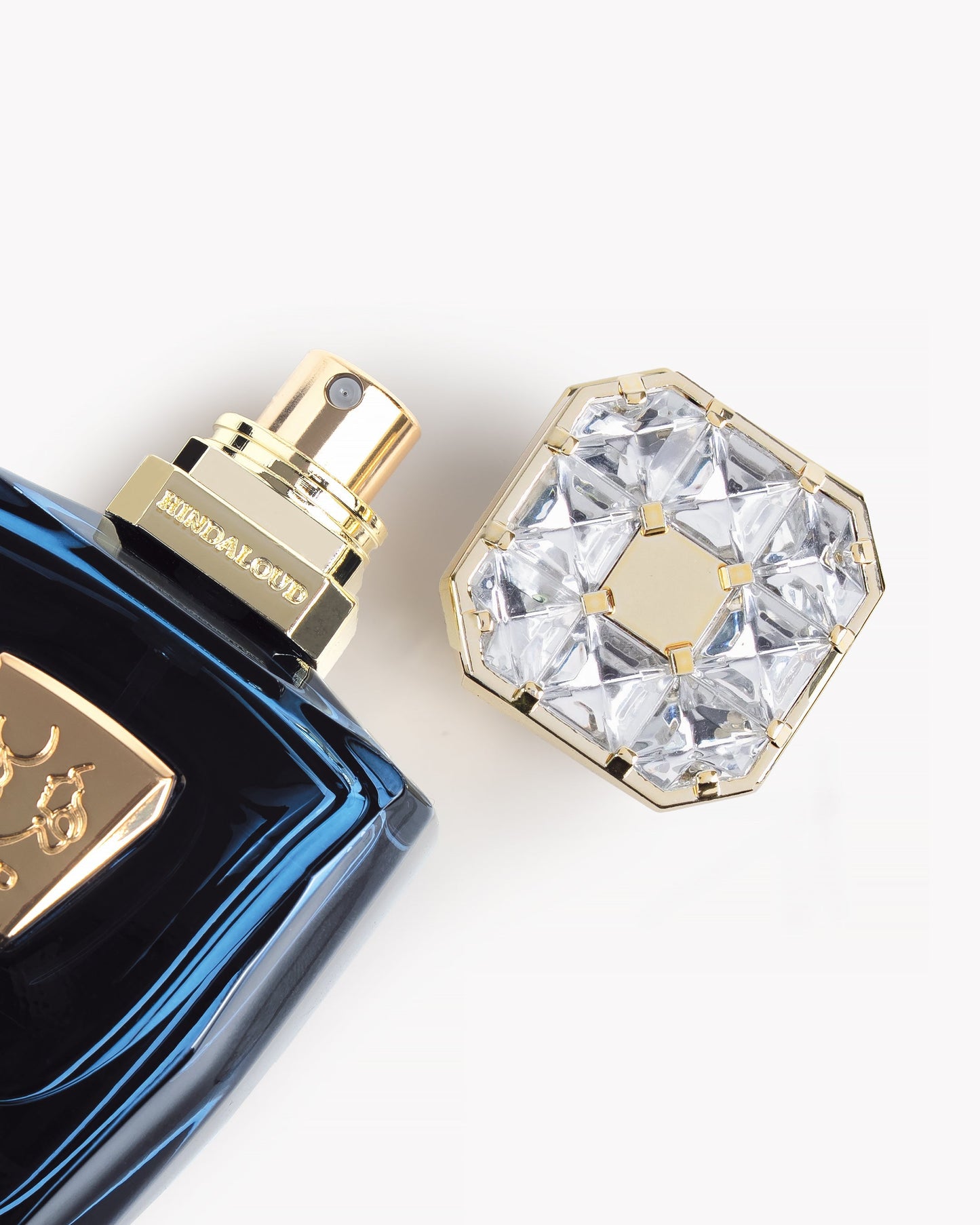 Dubai Mist by Hind AL Oud Perfume bottle with a decorative cap on a white background