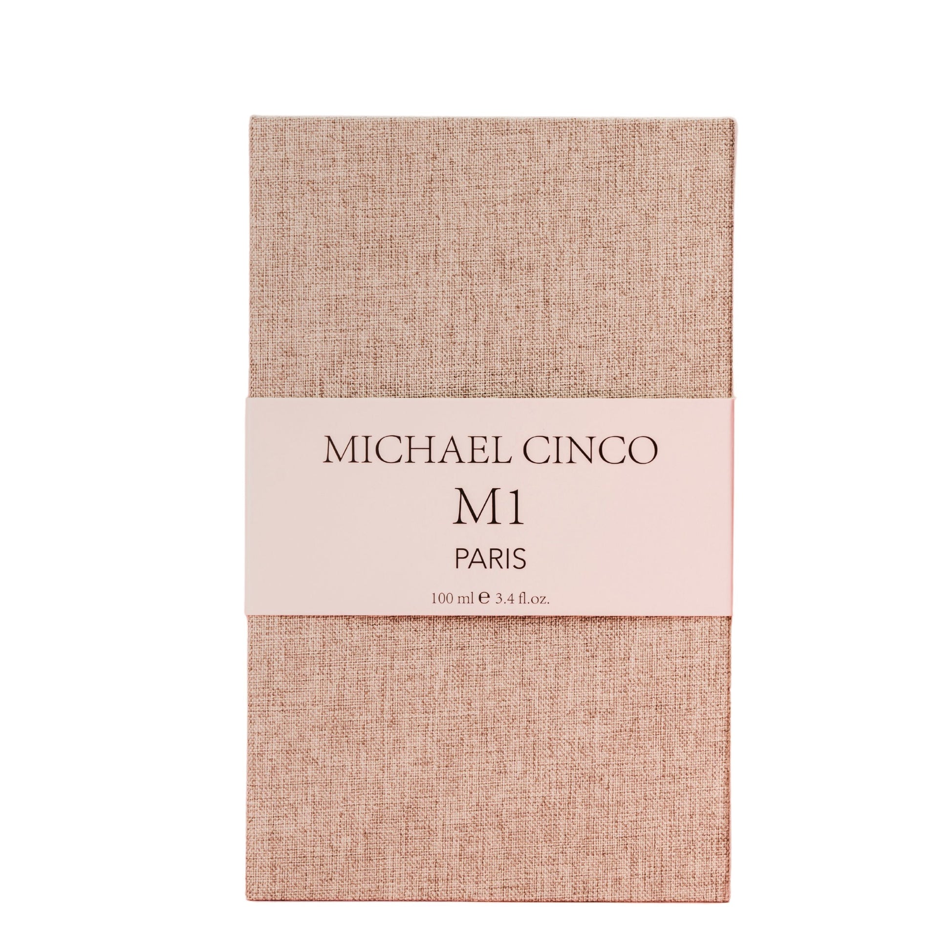 A beige textured rectangular box with a white band labeled Fragrapedia Haus M1 Eau de Parfum 100 ml, exuding a refined floral fragrance of rose and jasmine.