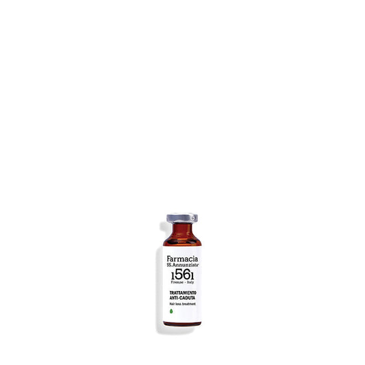 A small glass vial labeled Farmacia SS. Annunziata 1561 Hair loss treatment "TRATTAMENTO ANTI CADUTA" with a silver cap, designed to stimulate hair growth, stands upright on a white background.