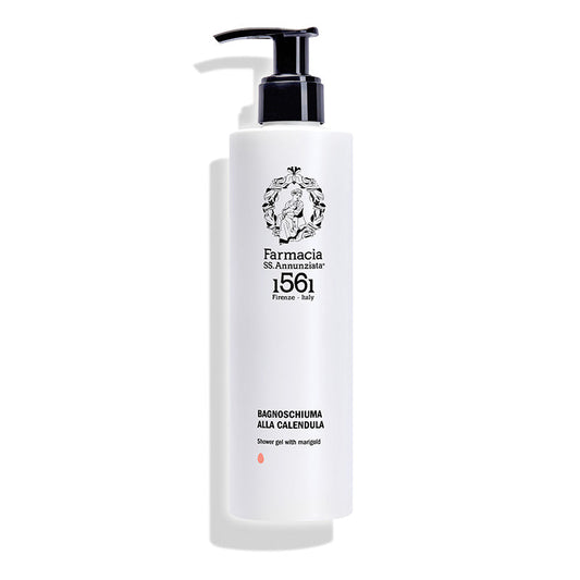 A white pump bottle labeled Farmacia SS. Annunziata 1561 holds the Body Shower Gel with Marigold “BAGNOSCHIUMA ALLA CALENDULA,” infused with soothing calendula extract and featuring black text and a crest logo.