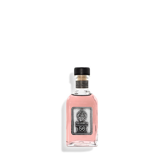 A small glass bottle of Vaiai e Pellicciai DIFFUSER by Farmacia SS. Annunziata 1561, filled with pink liquid and topped with a black cap, sits centered on a white background. Its elegant rosy scent gently perfumes any room.