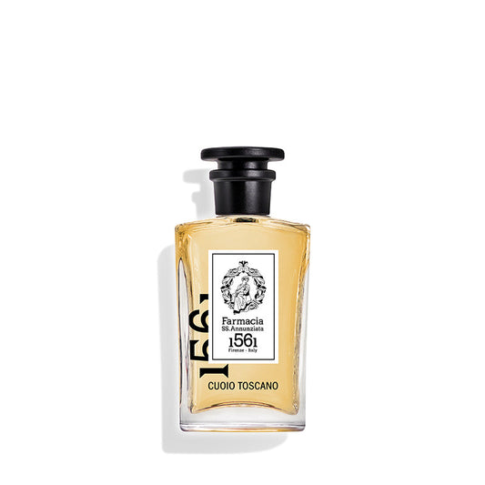 Cuoio Toscano Eau de Parfum by Farmacia SS. Annunziata 1561 features a clear glass bottle with light amber liquid, black cap, and white label, evoking a refined leather scent for true fragrance connoisseurs.