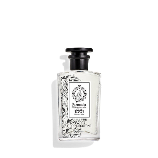 Fiore di Cotone Eau de Parfum by Farmacia SS. Annunziata 1561 comes in a clear glass bottle with a black cap, black floral accents, and a white label—offering a clean, pure scent with timeless elegance.