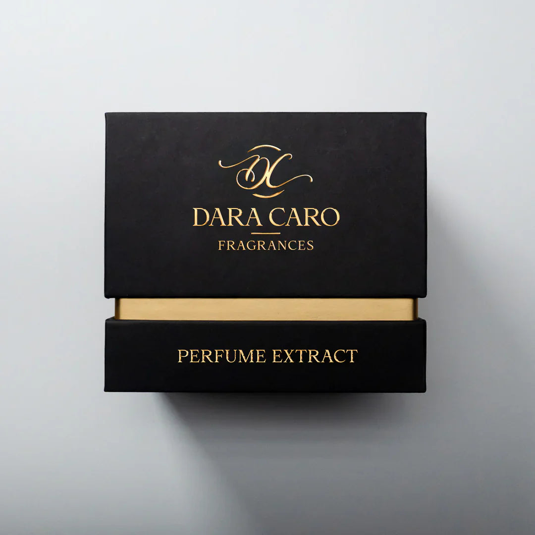 Black and gold words Dara Caro  Fragrances Perfume Extract fragrance box on white background 