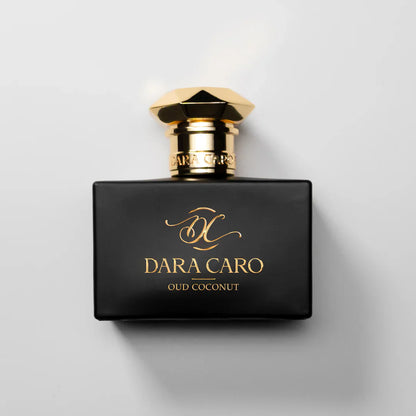 fragrance bottle  on white background .Black and gold cap & lettering  brand Dara Caro OUD COCONUT