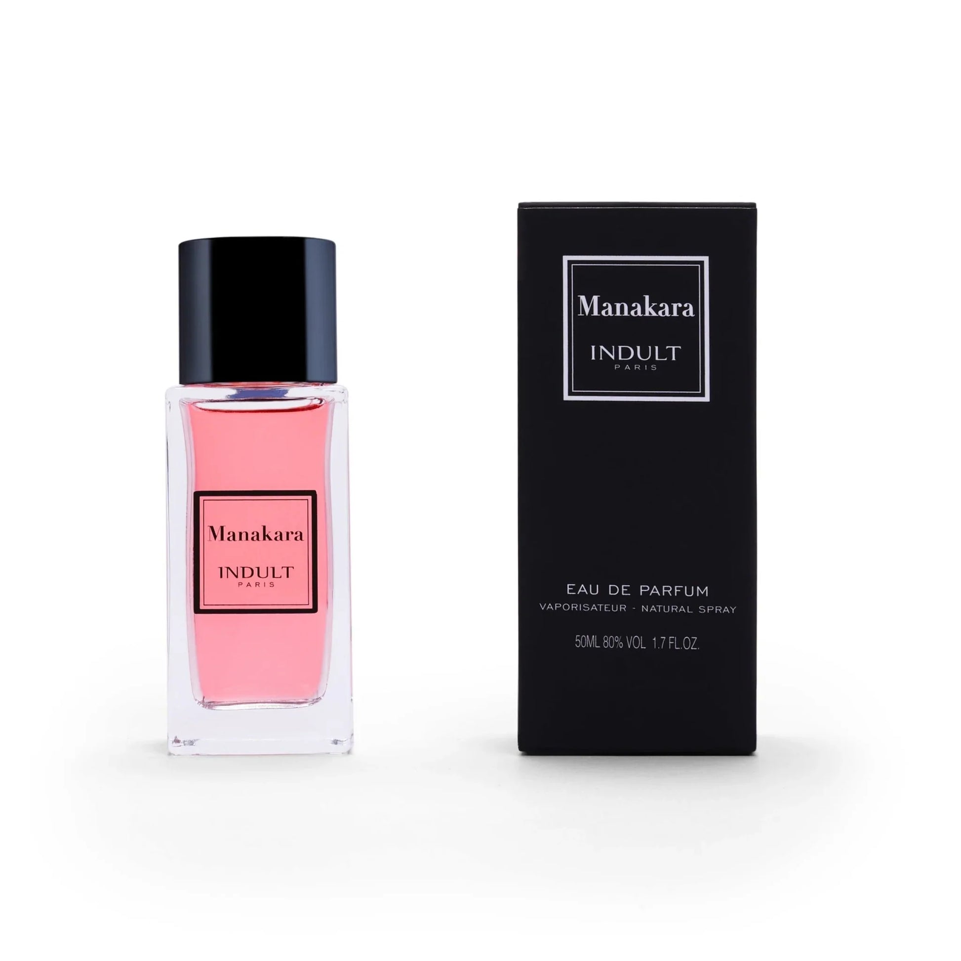 A bottle of Manakara Eau de Parfum by Fragrapedia Haus, with pink liquid, is shown beside its black box; both have minimalist white and black labels. This 50 ml lychee and Damascena rose scent is an Eau de Parfum.