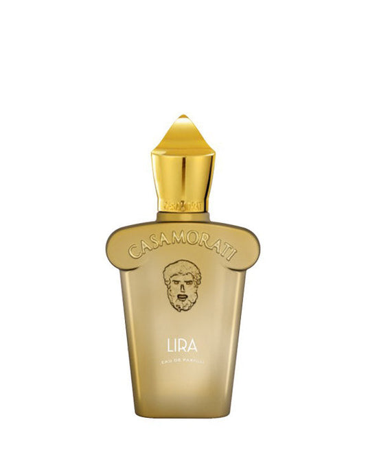 A gold bottle of Lira Eau de Parfum by Fragrapedia Haus, featuring a sculpted stopper and embossed face, stands against a white background. This elegant vanilla fragrance exudes sophistication.