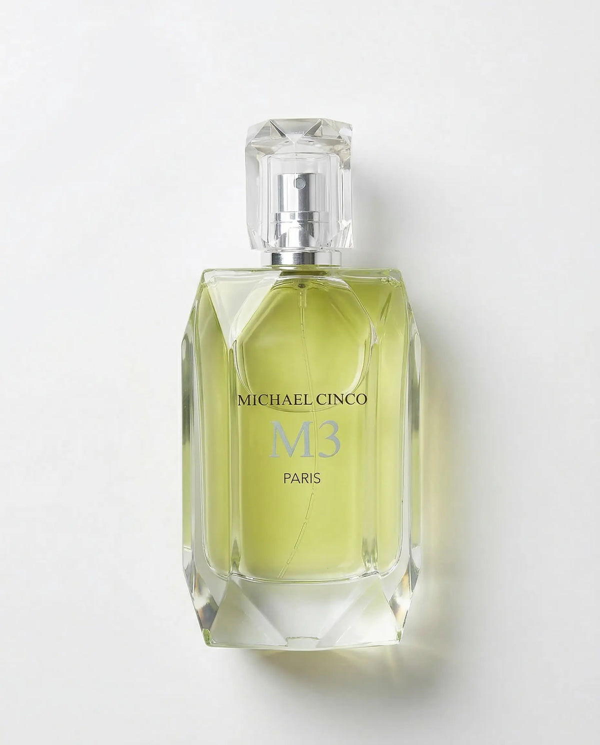 Perfume bottle labeled 'Michael Cinco M3 Paris' on a white background.