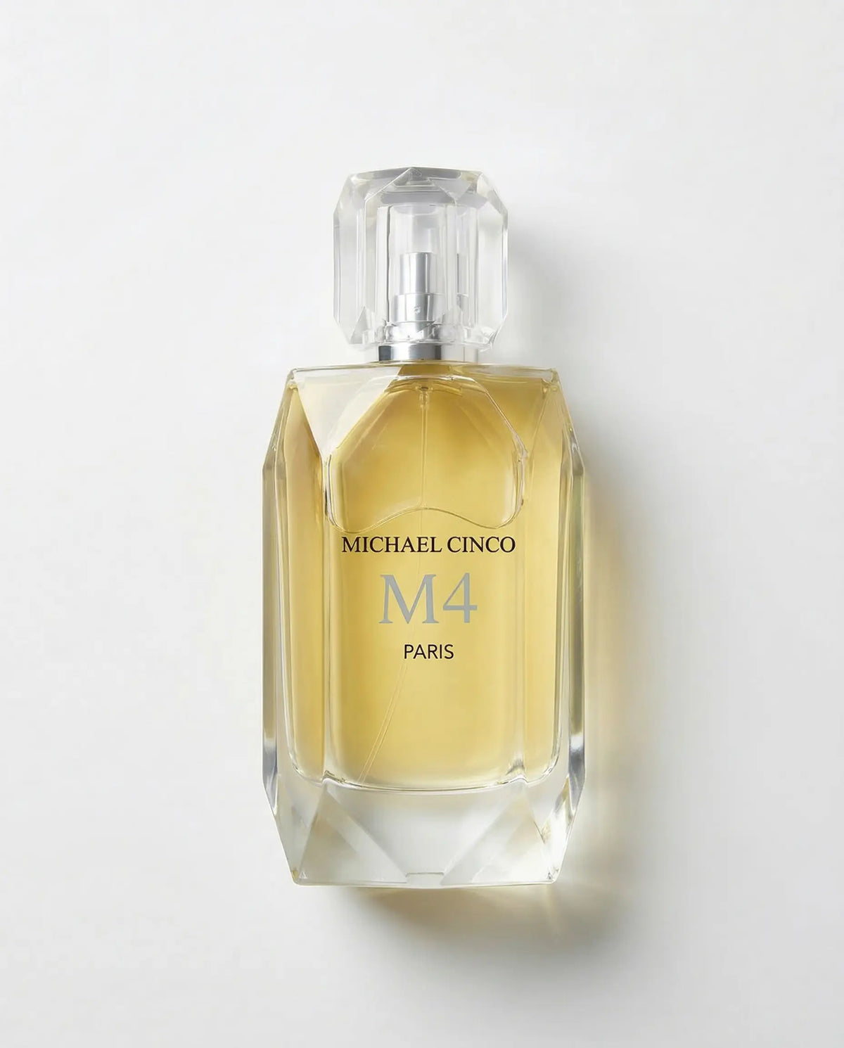 Perfume bottle labeled 'Michael Cinco M4 Paris' on a white background