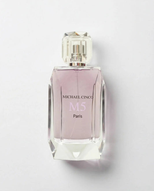Perfume bottle with pink label on a light gray background MICHAEL CINCO M5