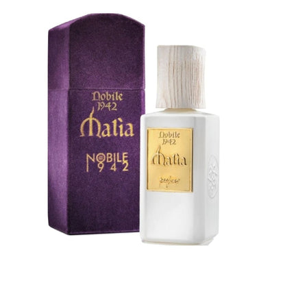 A white MALIA Eau de Parfum bottle by Nobile 1942 with a wooden cap and gold label sits beside its tall, purple velvet box, both featuring gold text, shown on a white background—a floral oriental fragrance evoking seduction.