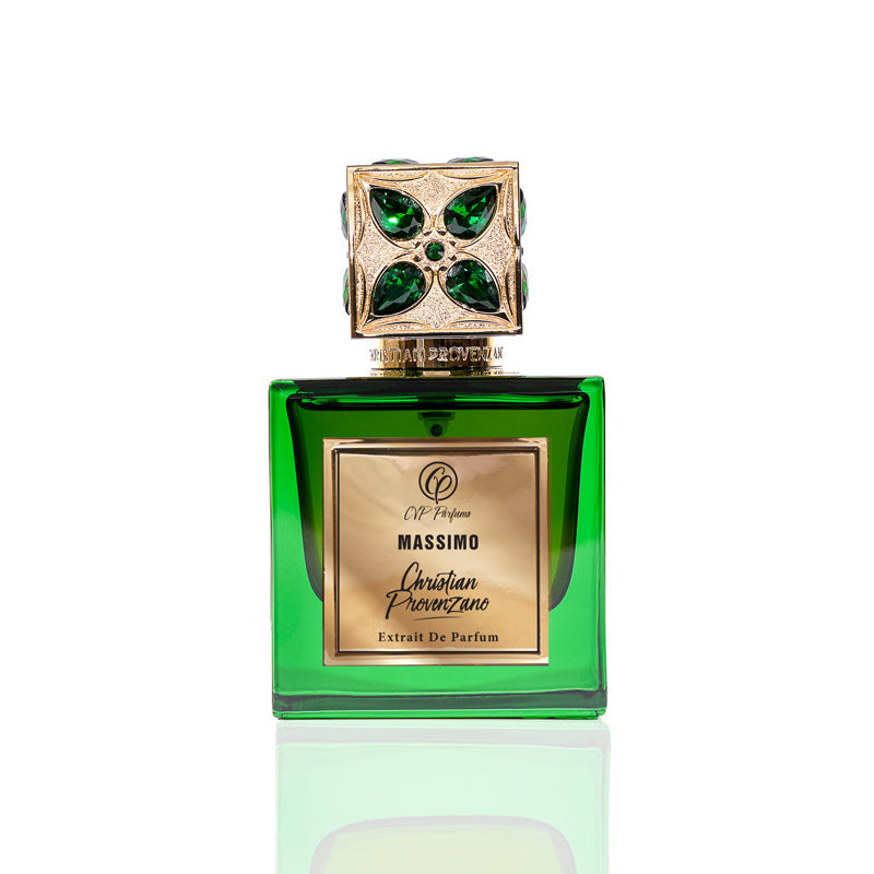 A green glass bottle with a jeweled gold and green cap and gold "Massimo" label holds Massimo Eau de Parfum by Christian Provenzano, a bold spicy amber scent, shown on a white background.