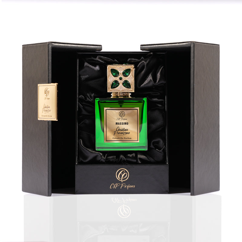 Massimo Eau de Parfum by Christian Provenzano is housed in a luxurious green glass bottle with a gold label and ornate cap, presented in an open black satin-lined box with gold accents and the CP Parfums logo. This spicy amber scent exudes elegance.