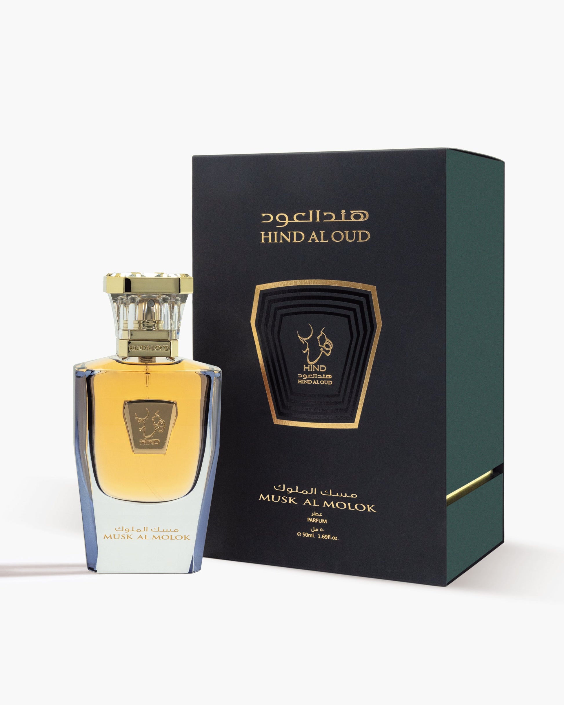 A bottle of Hind Al Oud Musk Al Molok Parfum with a gold cap is displayed beside its dark green, gold-accented box, both showing the brand and product name in Arabic and English.