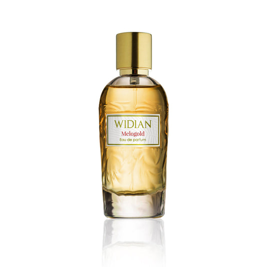 A clear glass bottle of Melogold Eau de Parfum by Fragrapedia Haus, featuring golden liquid, a shiny gold cylindrical cap, and vibrant grapefruit-leather notes, is displayed against a white background.