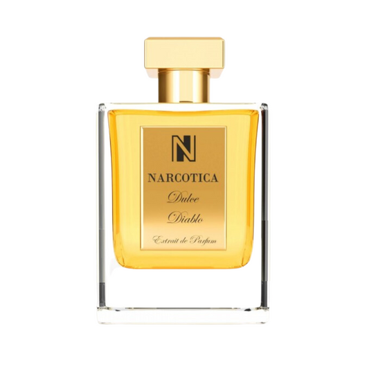 A clear glass bottle with a gold cap and gold label reading "Dulce Diablo Eau de Parfum - Narcotica" holds golden yellow liquid, reflecting the rich Madagascar vanilla notes in this captivating Narcotica fragrance.