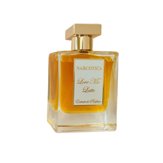 A clear glass perfume bottle with a gold cap and a "Love Me Latte Eau de Parfum - Narcotica" label contains an amber-toned fragrance, displayed against a white background.