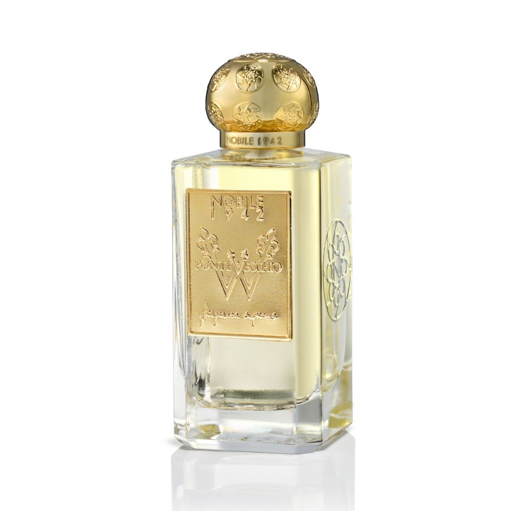 A clear glass perfume bottle with a gold ornate cap and label engraved with Nobile 1942 contains Pontevecchio W Eau de Parfum, a floral scent from the Fragranza Suprema Collection by Nobile 1942.