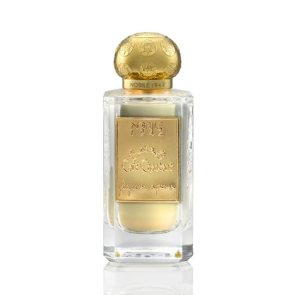 A clear glass bottle with a gold decorative cap and label displays light yellow CAFE CHANTANT Eau de Parfum by Nobile 1942, offering a refined gourmand fragrance ideal for evening wear.