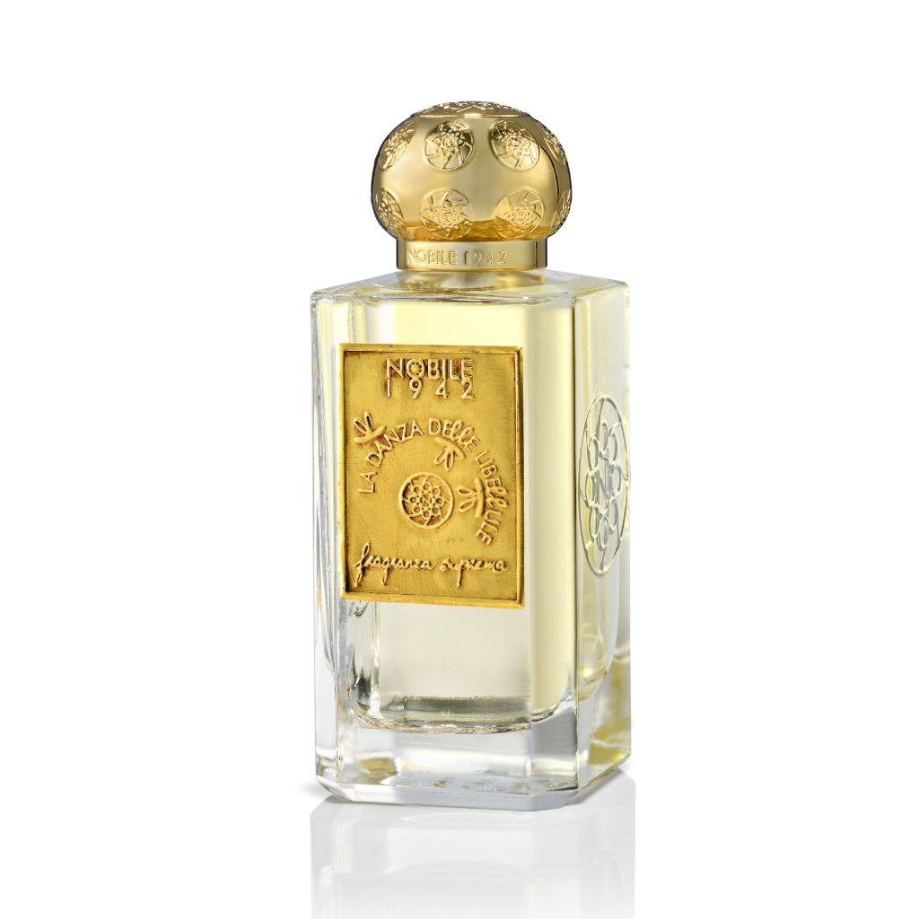 The LA DANZA DELLE LIBELLULE EDP by Nobile 1942 is a rectangular glass perfume bottle with a textured gold cap, gold label, and embossed details. It contains a pale yellow gourmand fragrance for aromatherapy.