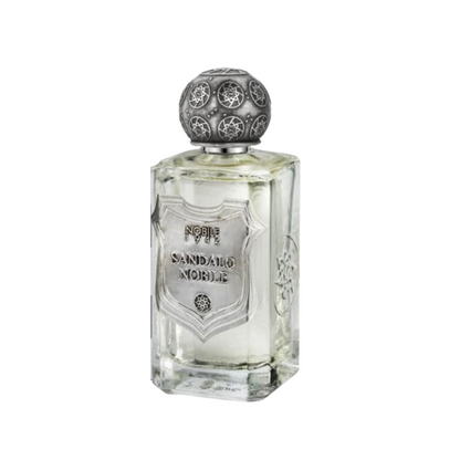 SANDALO NOBILE Eau de Parfum by Nobile 1942 comes in a clear glass bottle with an ornate round silver cap and decorative silver label, reflecting vintage elegance and hinting at the sandalwood fragrance within.