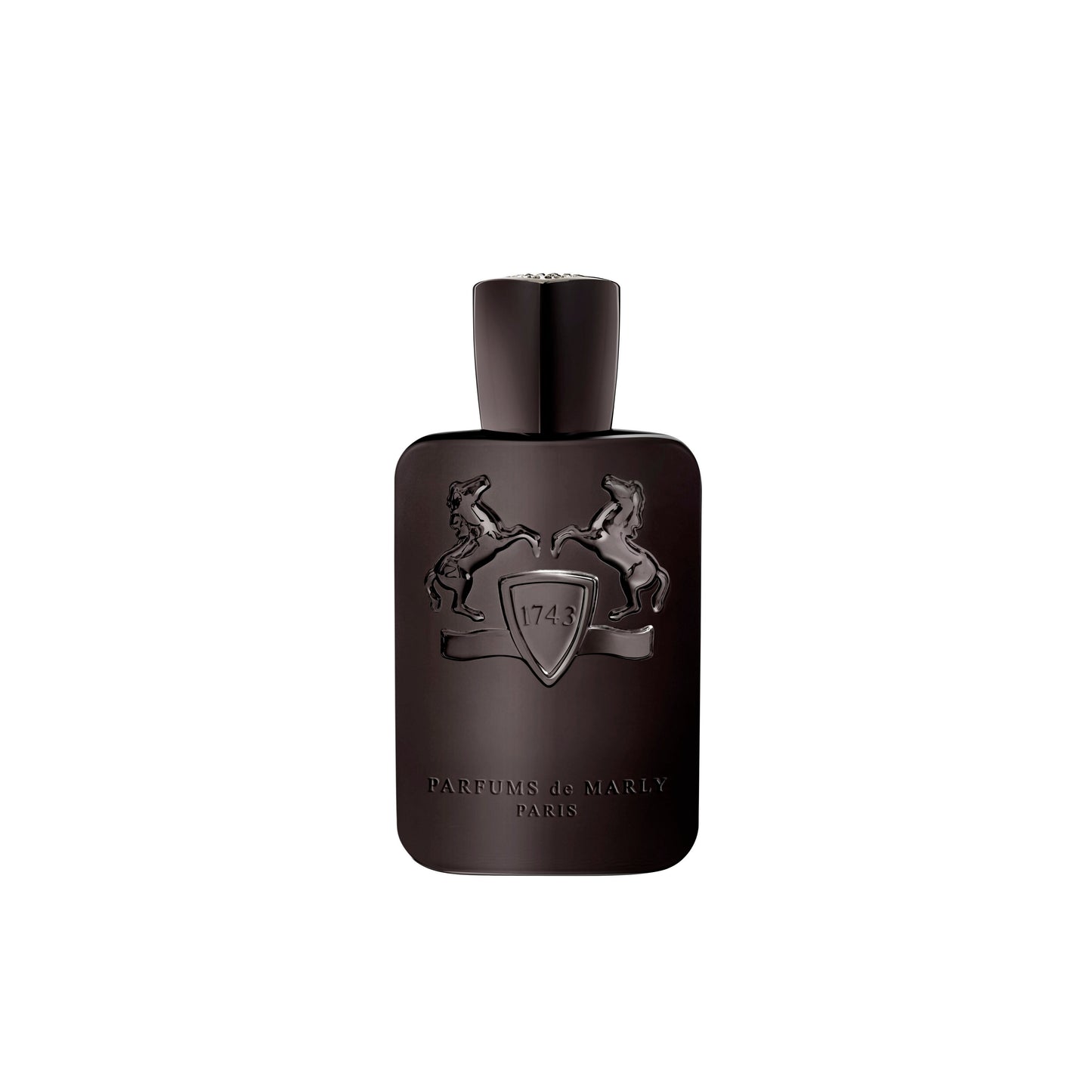 Herod Eau de Parfum by Parfums de Marly comes in a dark brown bottle embossed with two rearing horses and a central shield marked "1743." Near the base, the label reads Parfums de Marly Paris. Herod features rich tobacco and warm vanilla notes.