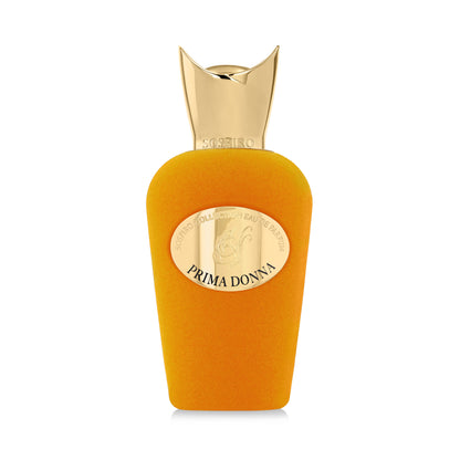 A vibrant orange Prima Donna Eau de Parfum by SOSPIRO features a large, shiny gold cap and an oval label reading PRIMA DONNA. This elegant floral fragrance stands out against the plain white background.