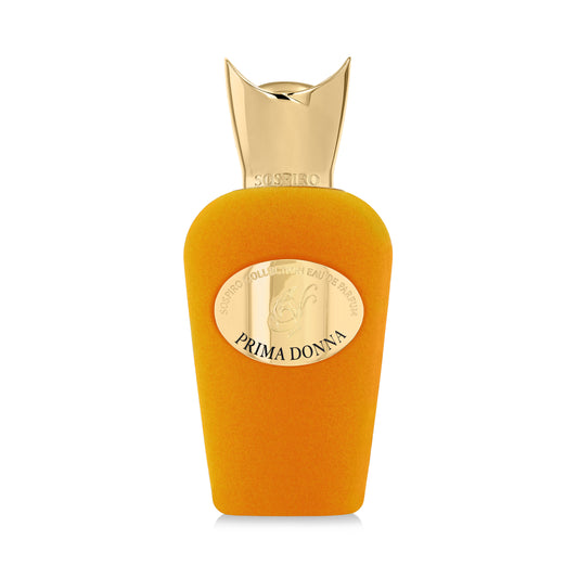 A vibrant orange Prima Donna Eau de Parfum by SOSPIRO features a large, shiny gold cap and an oval label reading PRIMA DONNA. This elegant floral fragrance stands out against the plain white background.