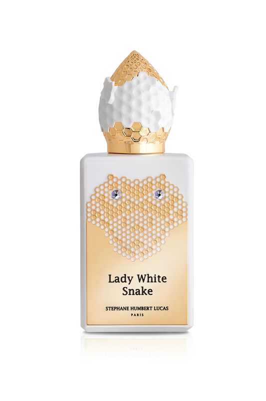 A white perfume bottle with a gold honeycomb design and textured cap. The label reads Lady White Snake Eau de Parfum by Fragrapedia Haus—a white floral scent inspired by the Chinese legend, Lady White Snake.