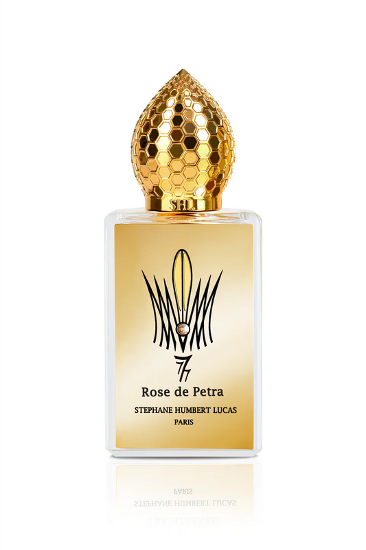 Rose de Petra Eau de Parfum by Fragrapedia Haus features a gold honeycomb-patterned cap, a gold label with the name and an abstract logo, and highlights exquisite Bulgarian Rose notes.