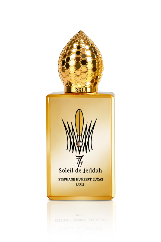 Soleil de Jeddah L'Original Eau de Parfum by Fragrapedia Haus dazzles with a golden bottle, honeycomb-patterned gold cap, and refined black text, celebrating the allure of amber and sophisticated oriental fragrances.