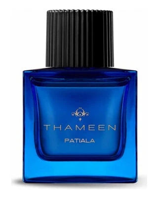 A blue rectangular Patiala Extrait de Parfum - Thameen London bottle by Fragrapedia Haus features a large black ribbed cap, gold lettering, and offers a luxurious floral scent inspired by the Maharaja of Patiala’s diamond necklace.