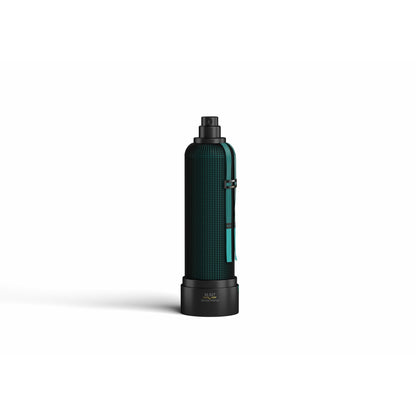 Refocus Eau de Parfum by M.INT stands upright on a plain white background, featuring a black and teal design with textured grip accents and a hint of patchouli-inspired style.
