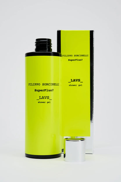 A vivid yellow bottle of Filippo Sorcinelli SUPERFLUO LAVS SHOWER GEL, inspired by incense, stands before its matching box. The black cap is off and placed next to the bottle on a white background.
