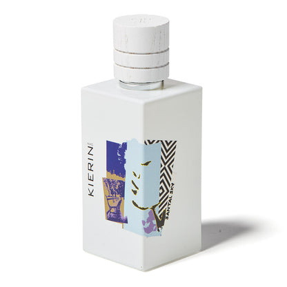 A white rectangular bottle with a white cap, featuring abstract blue, purple, yellow, and black art. "KIERIN" is on the side and "SANTAL SKY" on the front. Santal Sky Eau de Parfum by Kierin is a woody sandalwood-inspired fragrance.